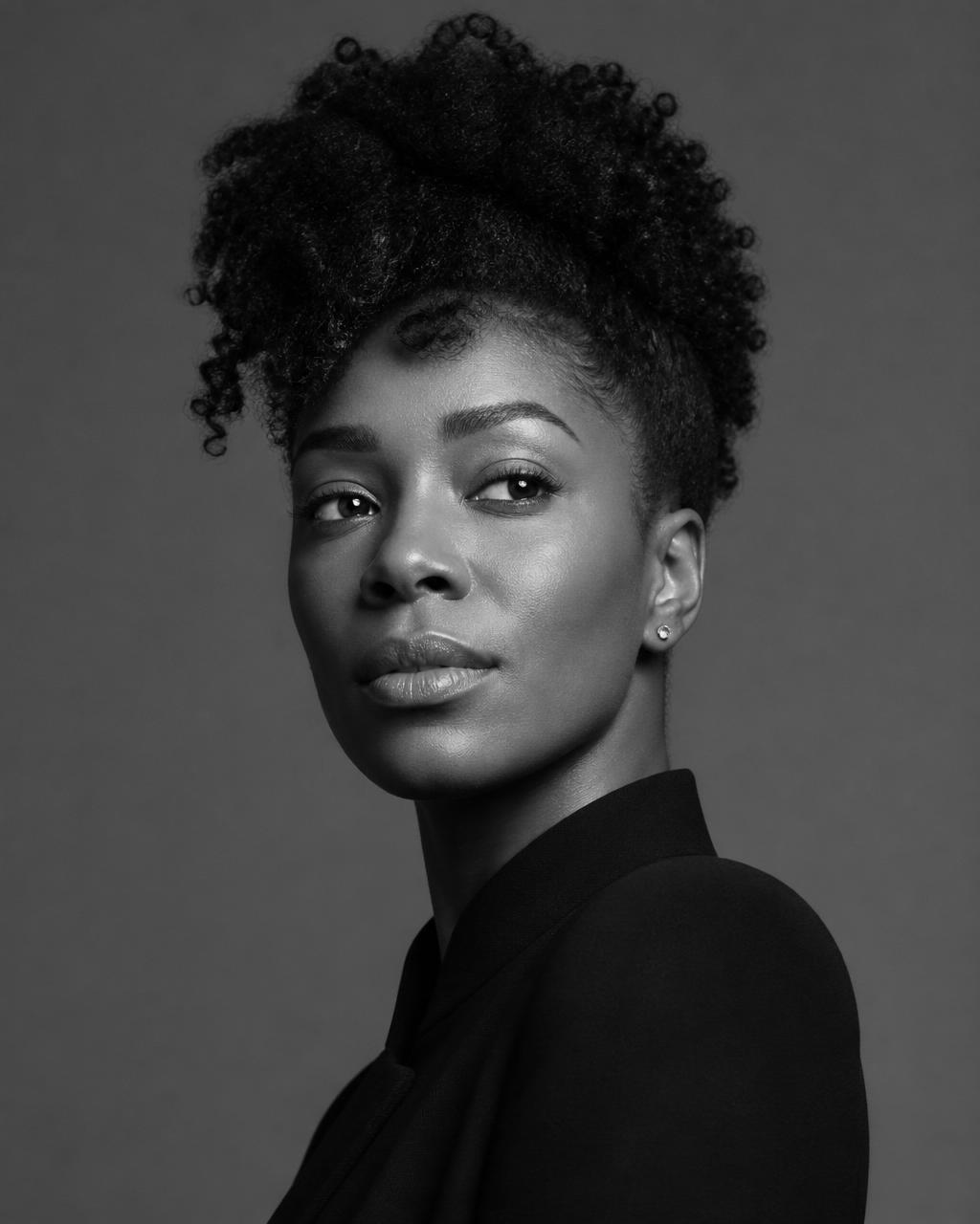 Confident Black woman with natural curls styled up